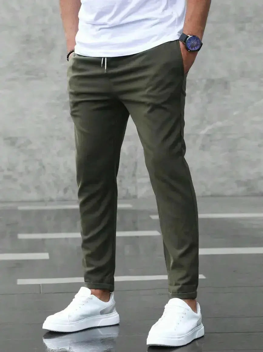 Men's slim fit casual drawstring trousers from Plush Fashion Hub, lightweight pants with pockets and a modern design.