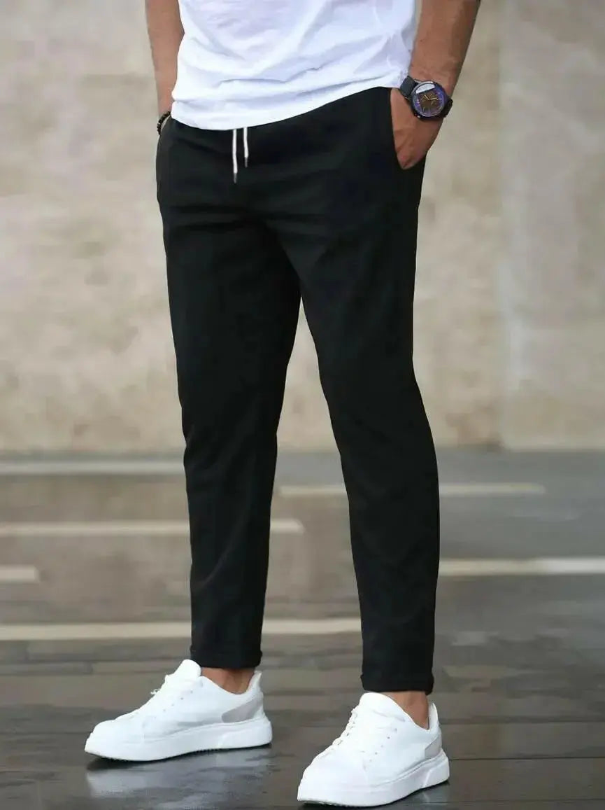 Men's slim fit casual drawstring trousers with pockets, lightweight pants from Plush Fashion Hub, suitable for everyday wear.