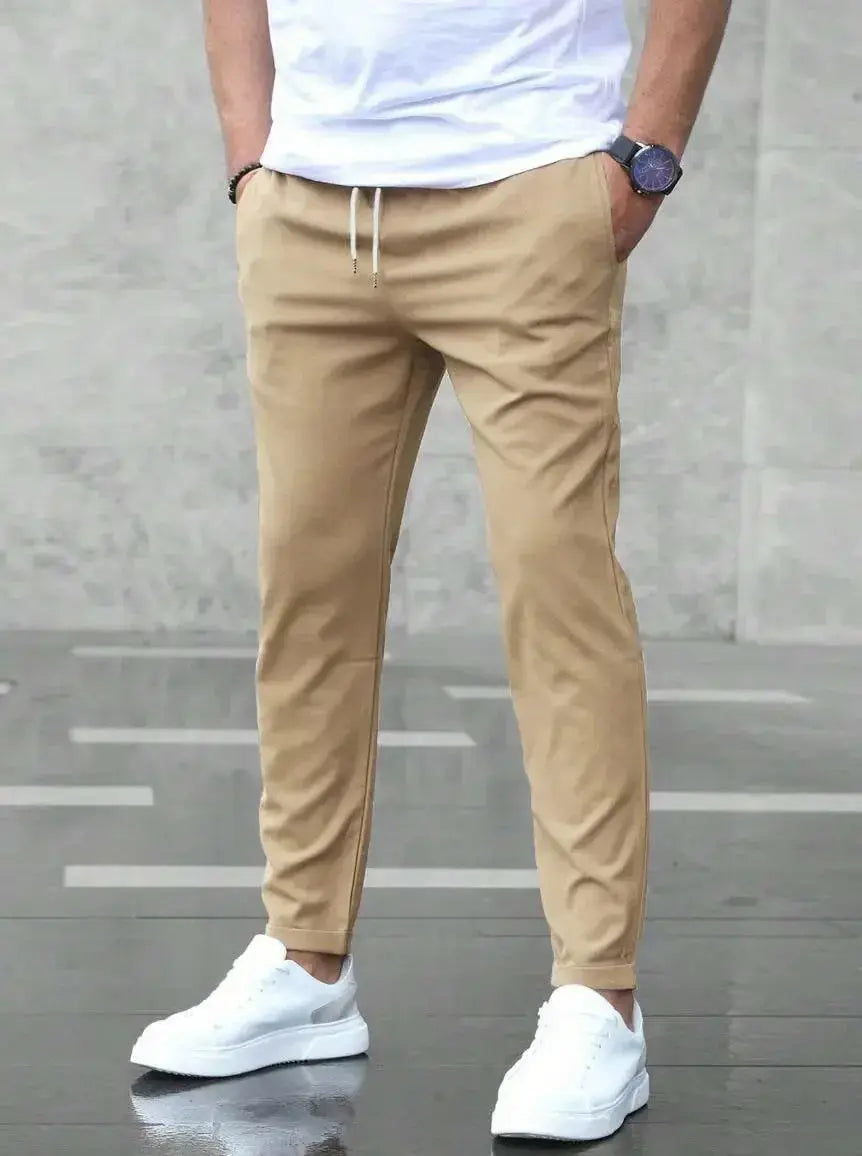 Men's slim fit casual drawstring trousers with pockets, lightweight pants from Plush Fashion Hub, suitable for everyday wear.