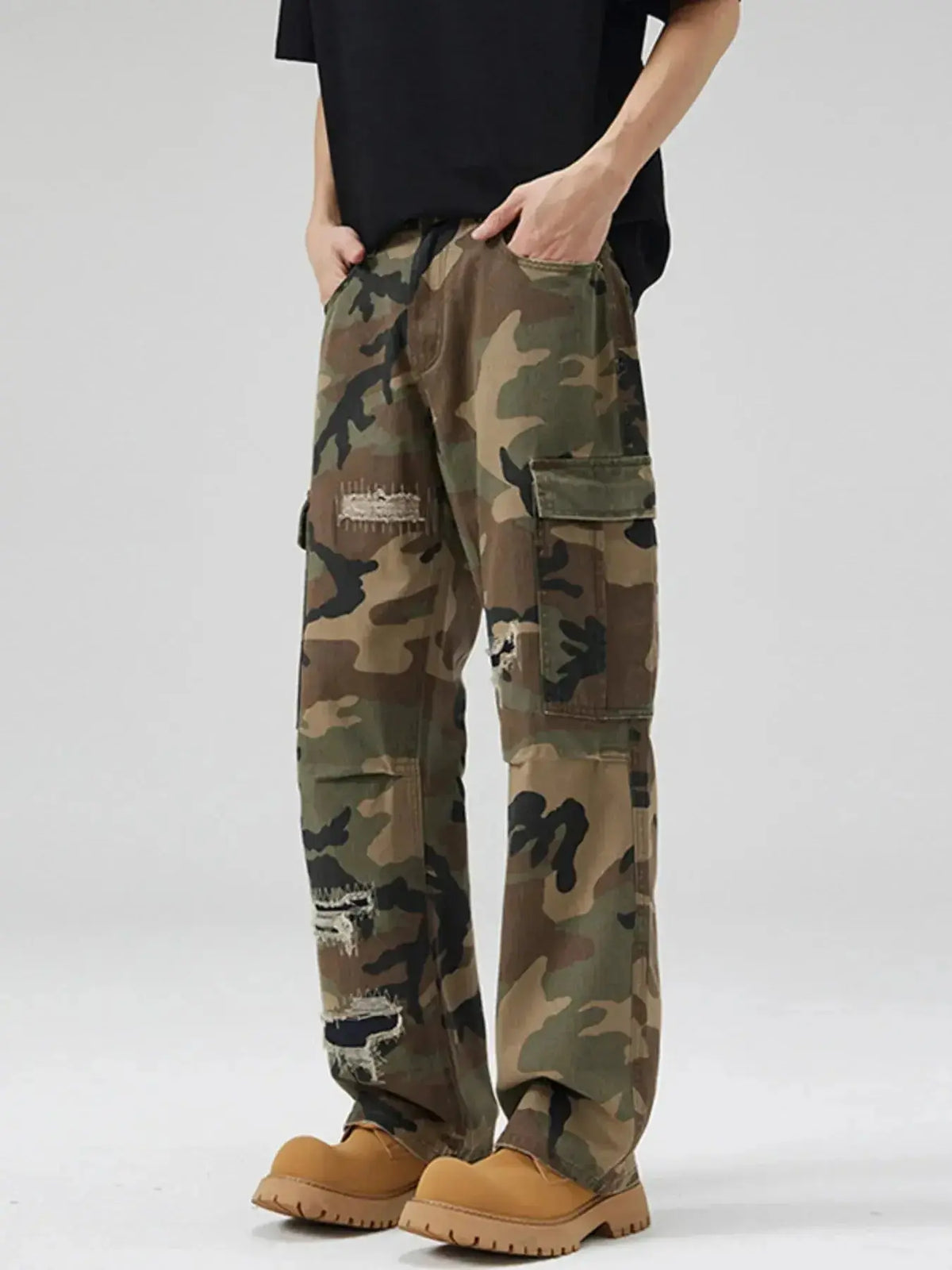Men's distressed camouflage cargo pants by Plush Fashion Hub, rugged cotton streetwear with utility and rugged styling.