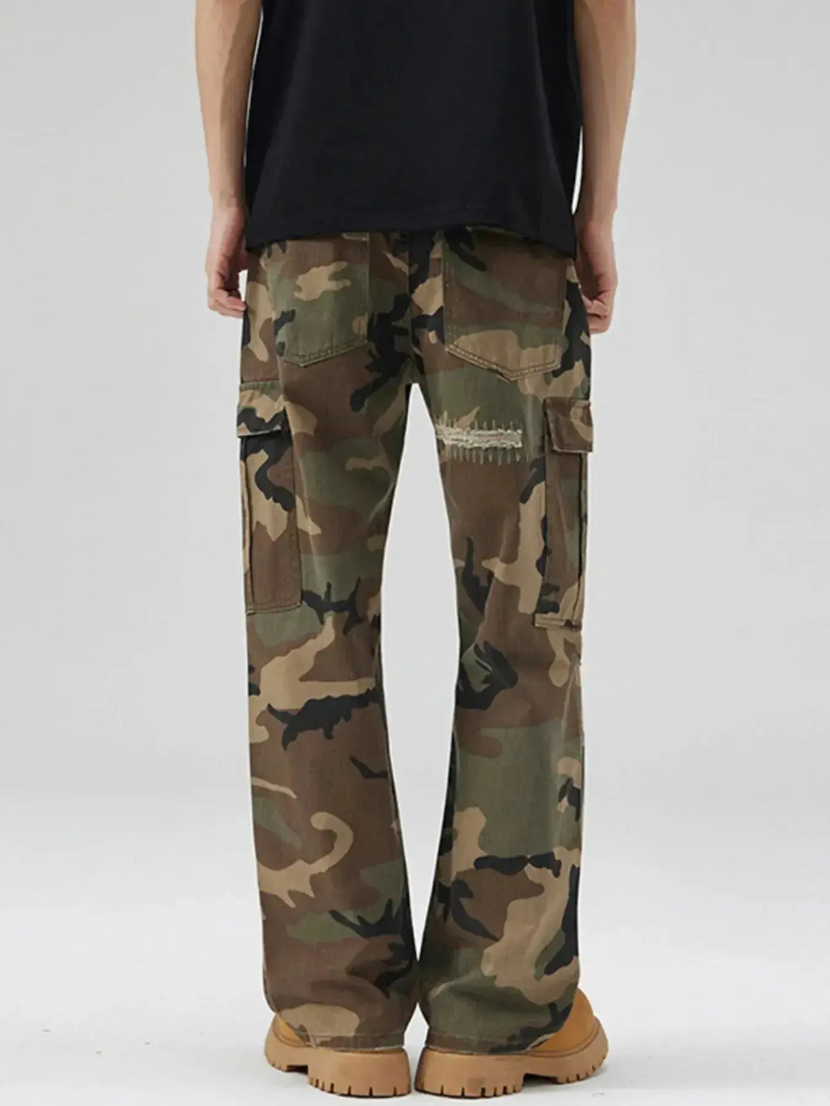 Men's distressed camouflage cargo pants by Plush Fashion Hub, rugged cotton streetwear with utility and military-inspired style.