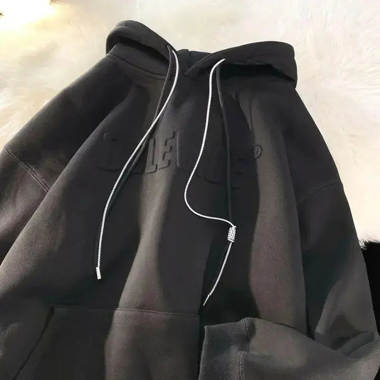 Men's relaxed fit streetwear hoodie by Plush Fashion Hub, oversized urban pullover with a casual, comfortable look.