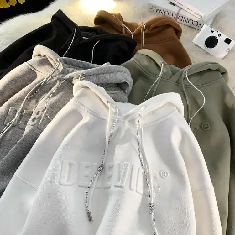 Men's relaxed fit streetwear hoodie by Plush Fashion Hub, oversized urban pullover with a comfortable, casual style.