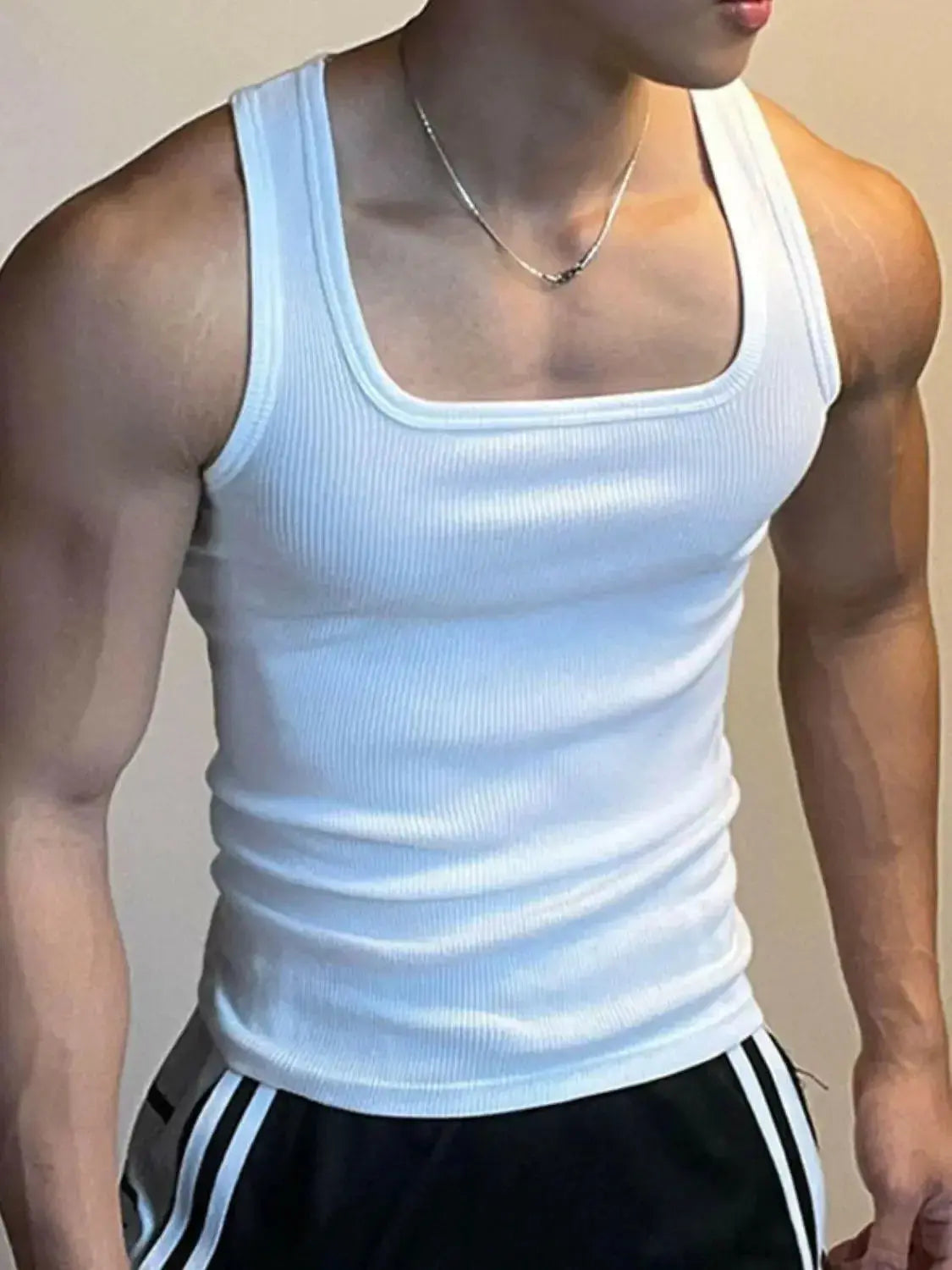 Men's sleeveless athletic tank top with square neck and wide straps, breathable fabric from Plush Fashion Hub.