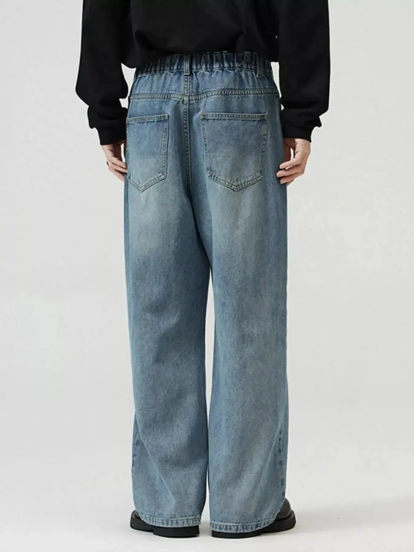 Men's washed straight-leg stretch jeans from Trendsi, featuring a comfortable fit and classic denim style.