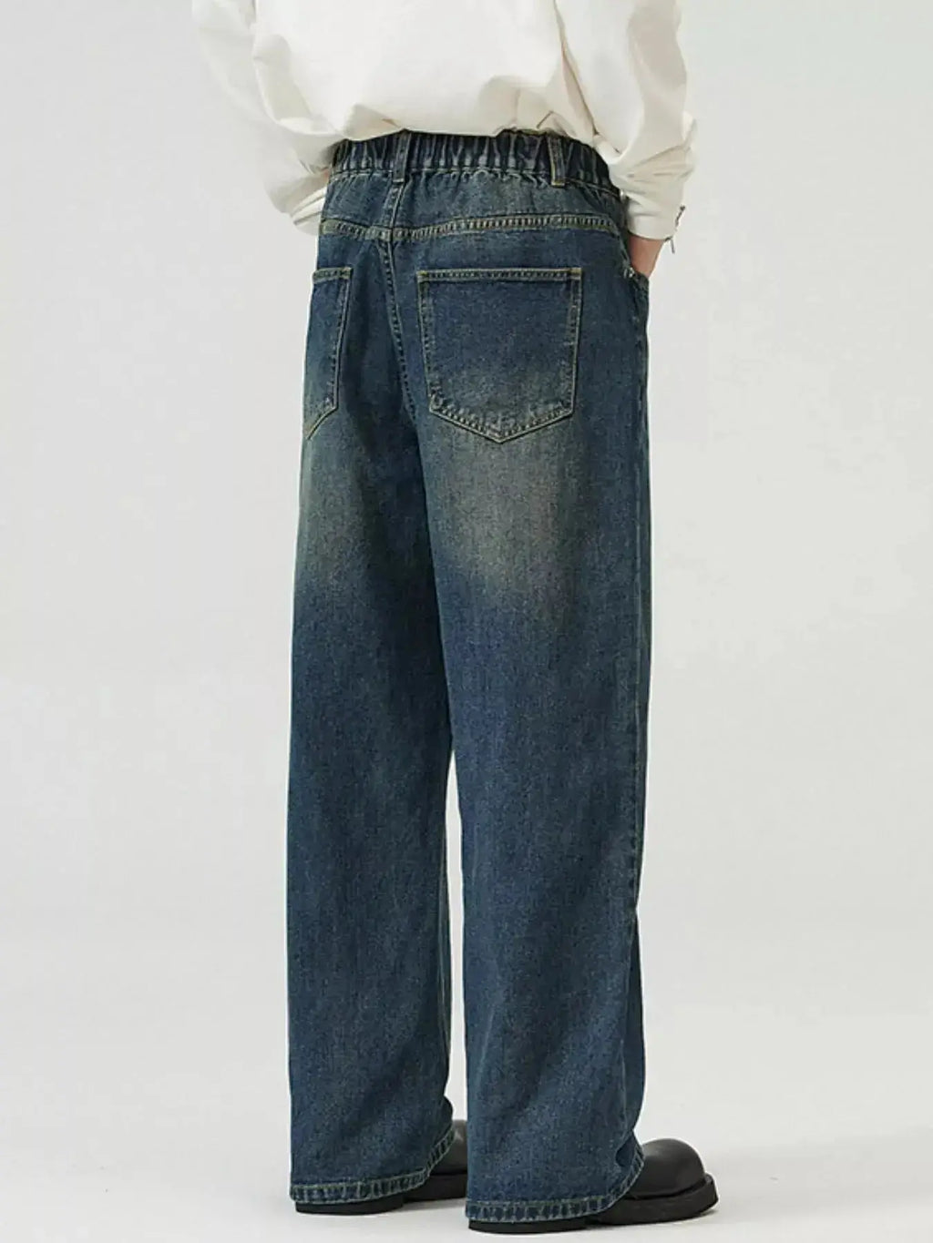 Men's washed straight-leg stretch jeans from Trendsi, showing comfortable fit and classic denim style.