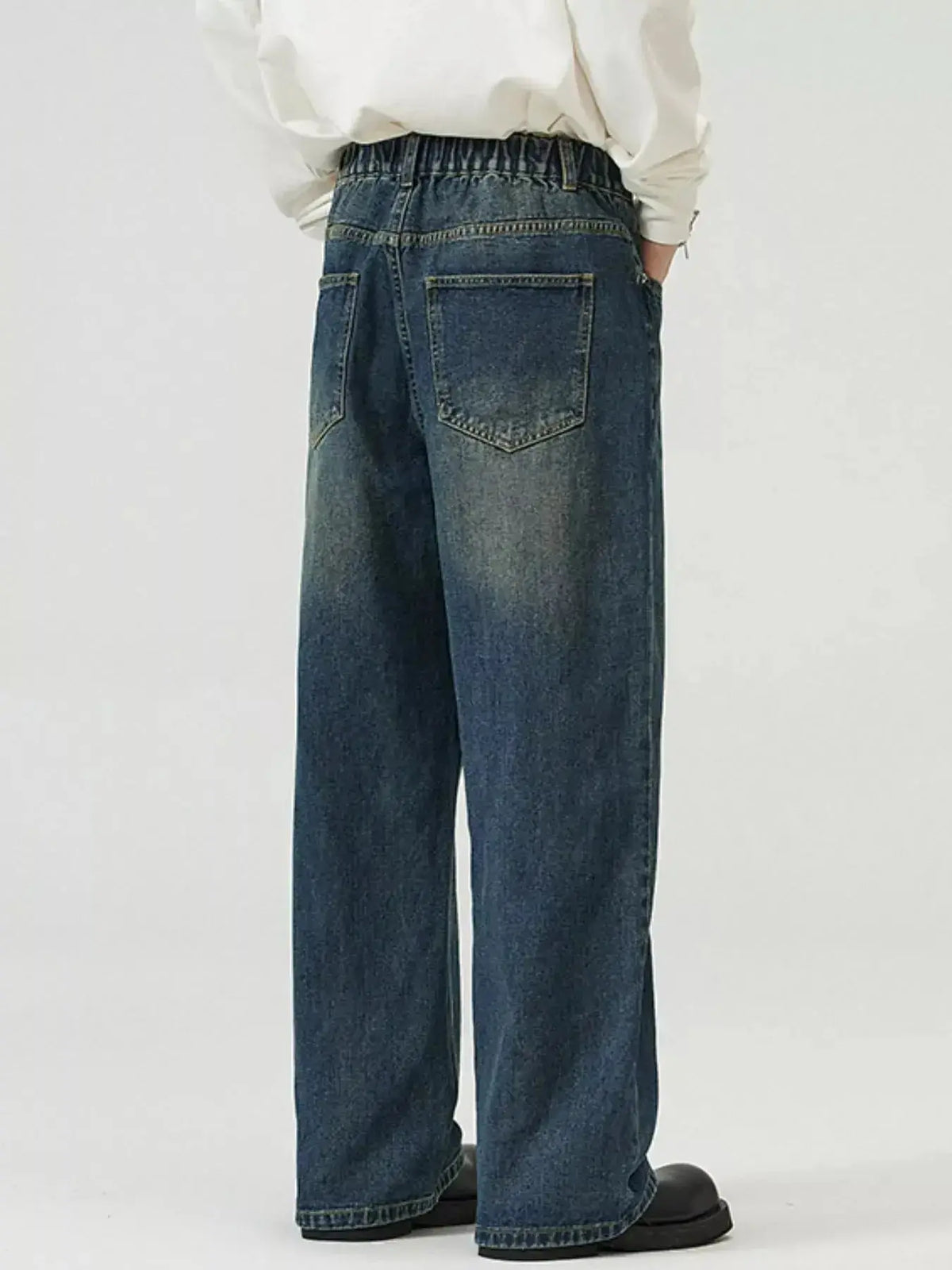 Men's washed straight-leg stretch jeans by Plush Fashion Hub, featuring a comfortable fit and classic denim style.