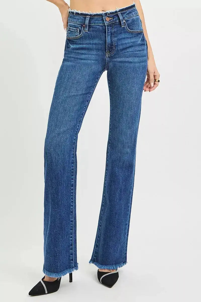 Plush Fashion Hub mid-rise bootcut jeans with frayed waist and raw hem, showcasing casual denim style and distressed details.