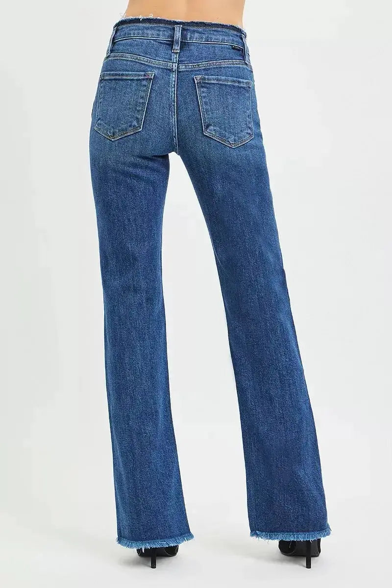 Plush Fashion Hub mid-rise bootcut jeans with frayed waist and raw hem, showcasing trendy distressed denim style.