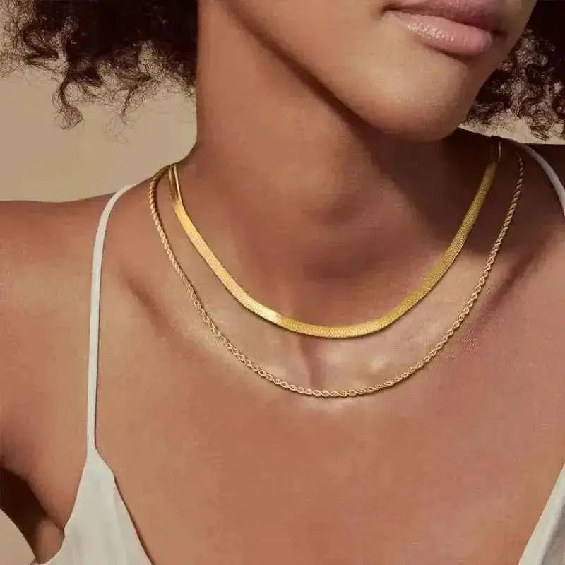 Minimalist gold cross pendant necklace with dainty chain, unisex design, layered style, from Plush Fashion Hub.