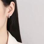 925 silver knot diamond earrings with a stylish, unique design featuring sparkling diamonds and a polished finish.