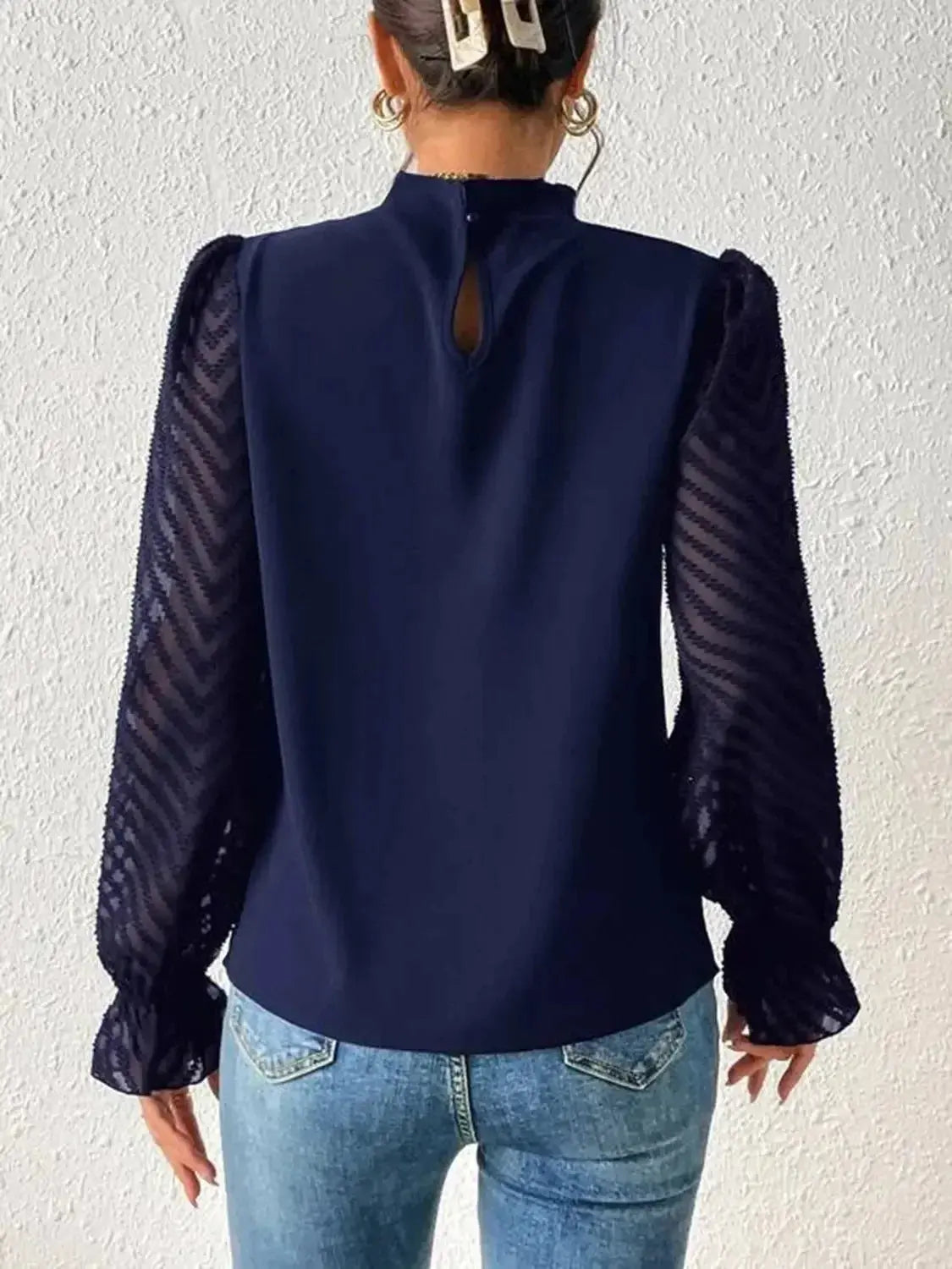 Elegant mock neck blouse with flounce sleeves from Plush Fashion Hub, shown in a stylish, flowy fabric.
