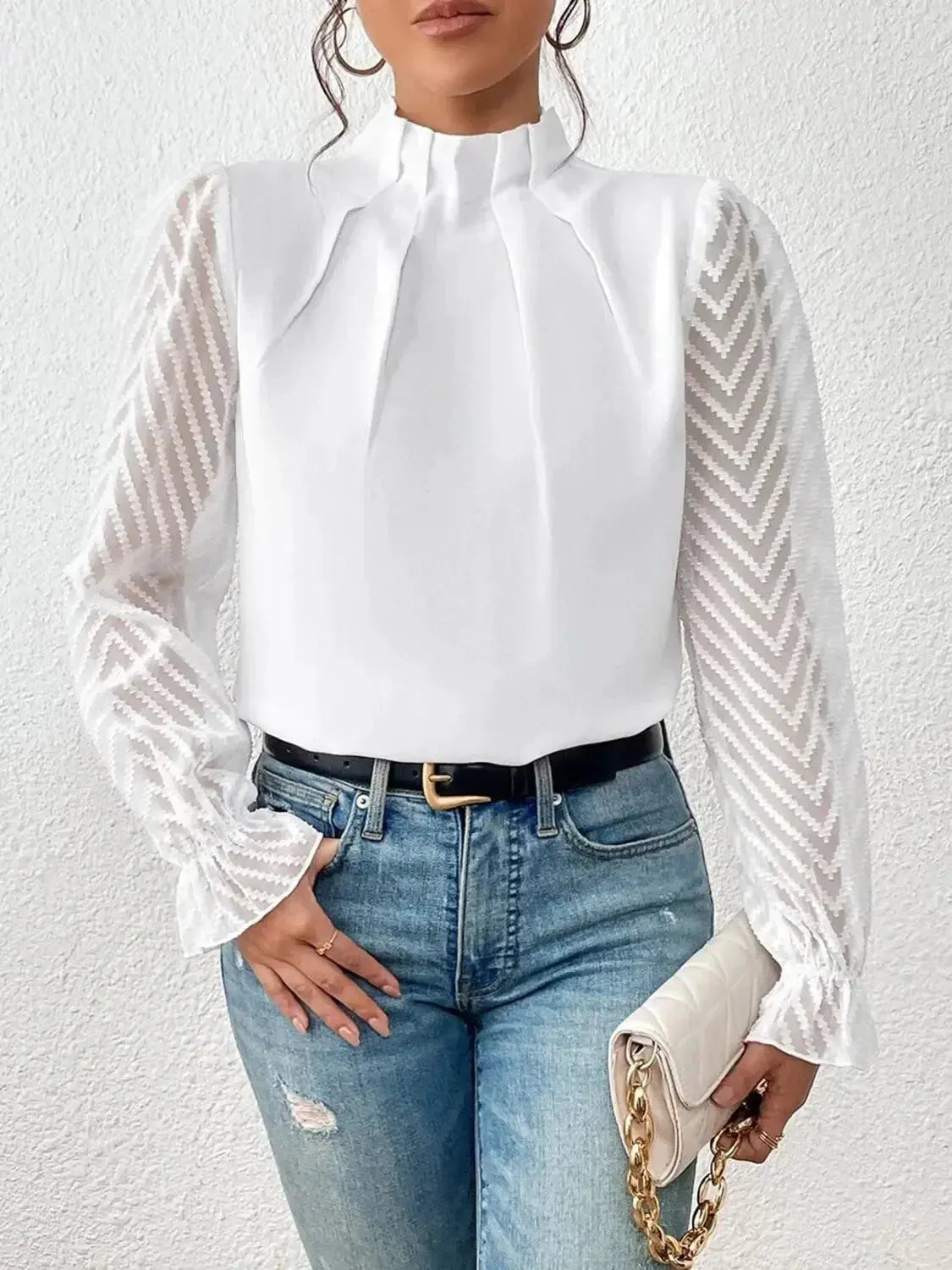 Elegant mock neck blouse from Plush Fashion Hub with stylish flounce sleeves, displayed on a hanger.