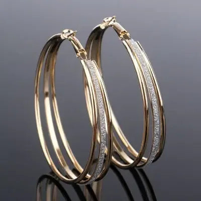 Modern multilayer forked circle earrings in two-tone gold and silver from Plush Fashion Hub, showing layered and textured design.