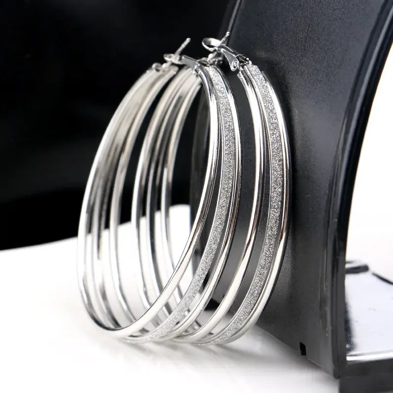 Modern multilayer forked circle earrings in two-tone gold and silver, stylish earrings by Plush Fashion Hub.