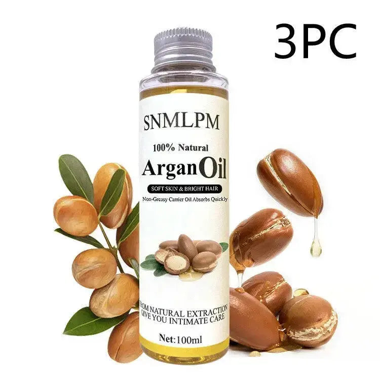 Natural argan hair oil by Plush Fashion Hub for deep hydration and frizz control, in a 100ml bottle.