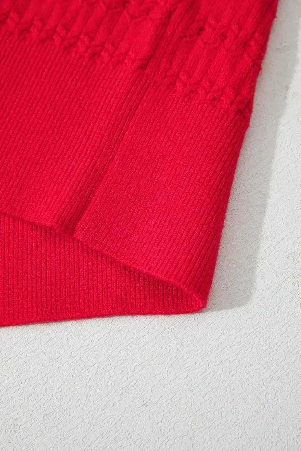 Nellie knit sweater with ribbed cuffs in a cozy, textured design by Threaded Pear, shown in a close-up view.