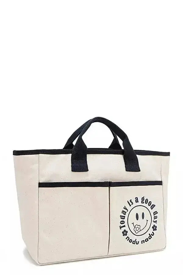 Artistic graphic print canvas tote bag by Plush Fashion Hub featuring bold, colorful artwork on durable canvas material.