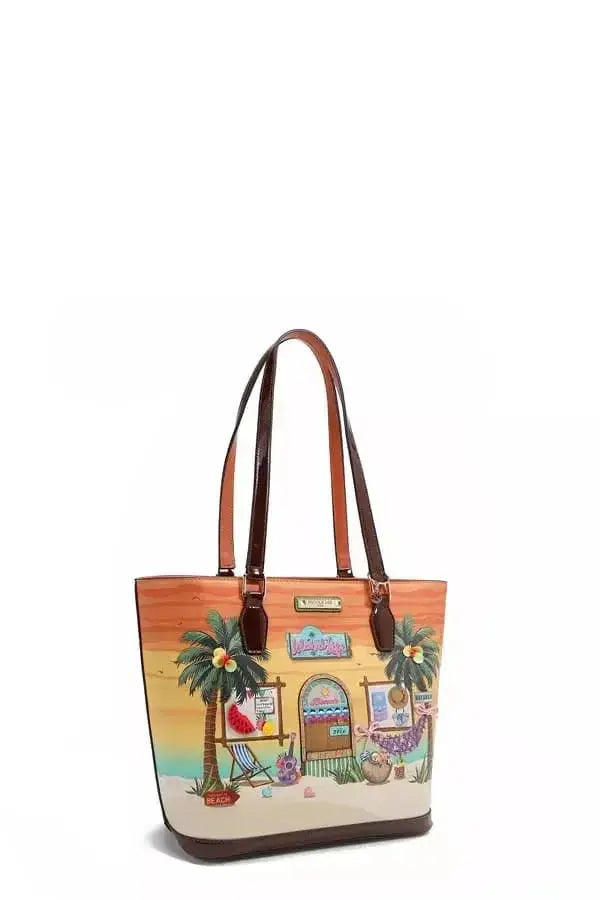 Vegan leather tote bag with tropical beach house print from Plush Fashion Hub, featuring spacious design and sturdy handles.