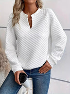 Women's plush fashion hub waffle-knit sweatshirt with notched raglan sleeves, soft textured pullover for casual wear.