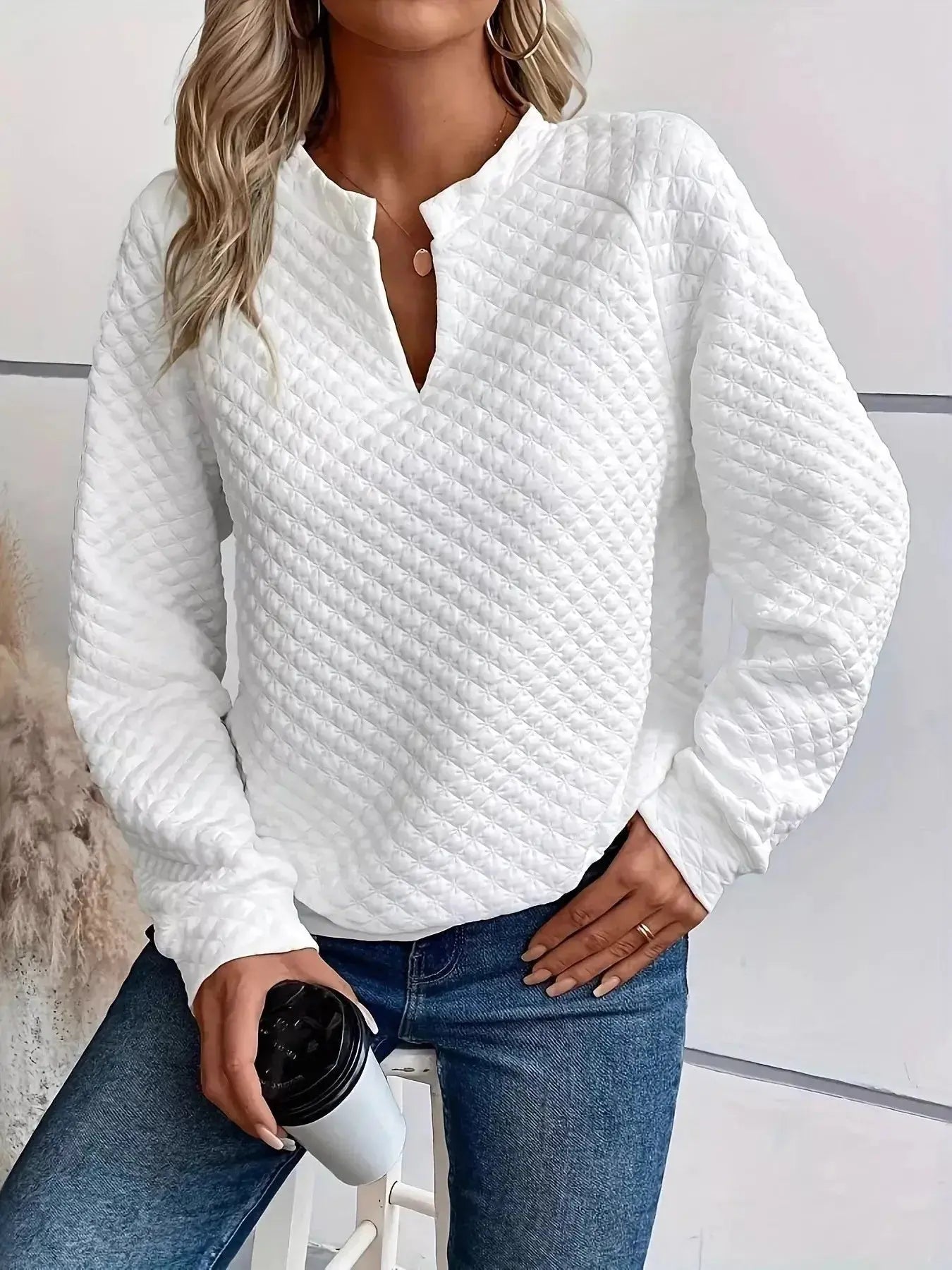Women's plush fashion hub waffle-knit sweatshirt with notched raglan sleeves, soft textured pullover for casual wear.