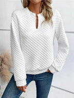 Women's notched raglan waffle-knit sweatshirt by Plush Fashion Hub, soft textured pullover with stylish raglan sleeves.
