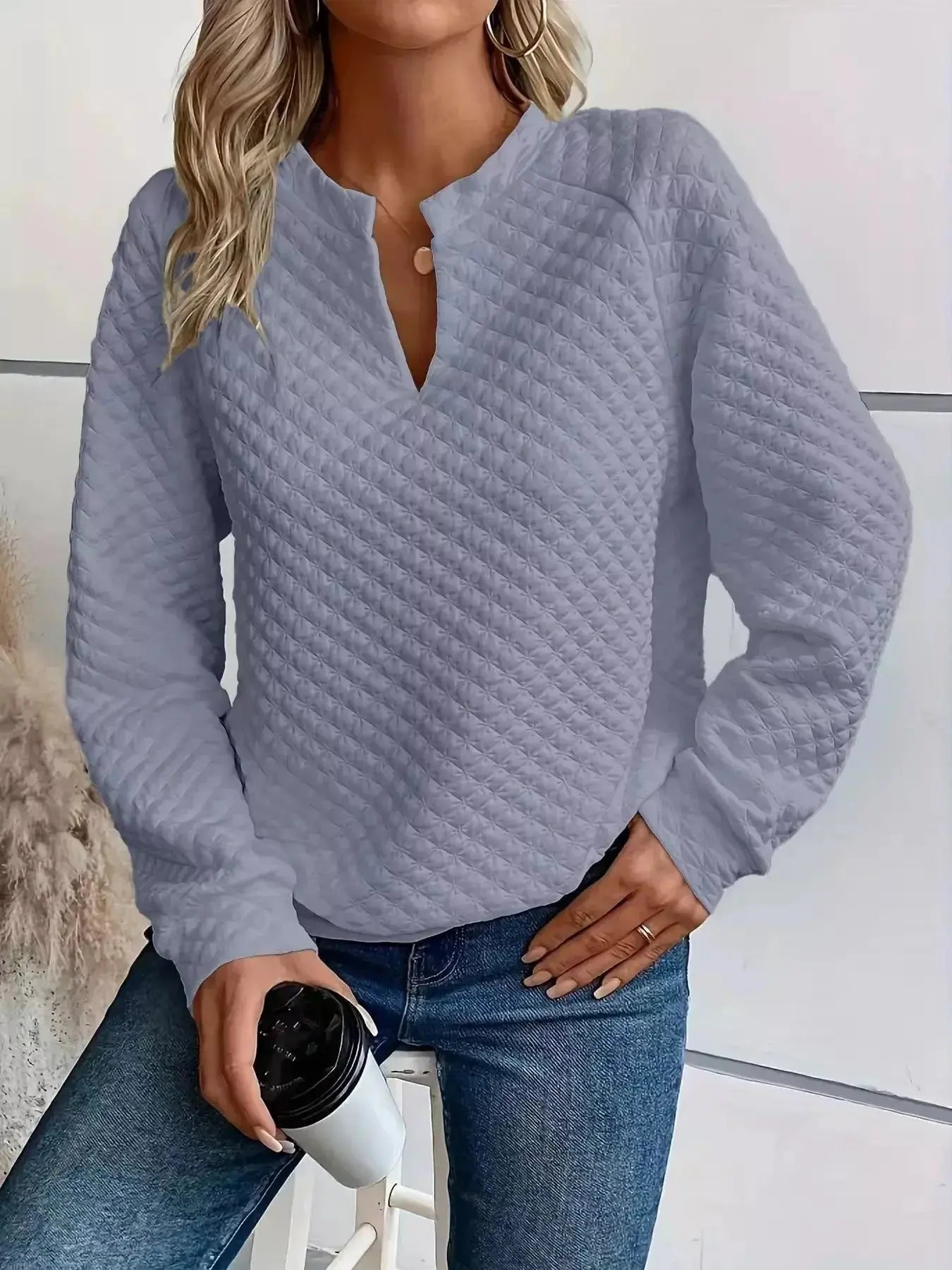 Women's notched raglan waffle-knit sweatshirt with textured soft fabric, featuring a stylish pullover design by Plush Fashion Hub.