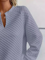 Soft textured women's waffle-knit raglan sweatshirt with notched sleeves from Plush Fashion Hub, casual pullover for comfortable style.