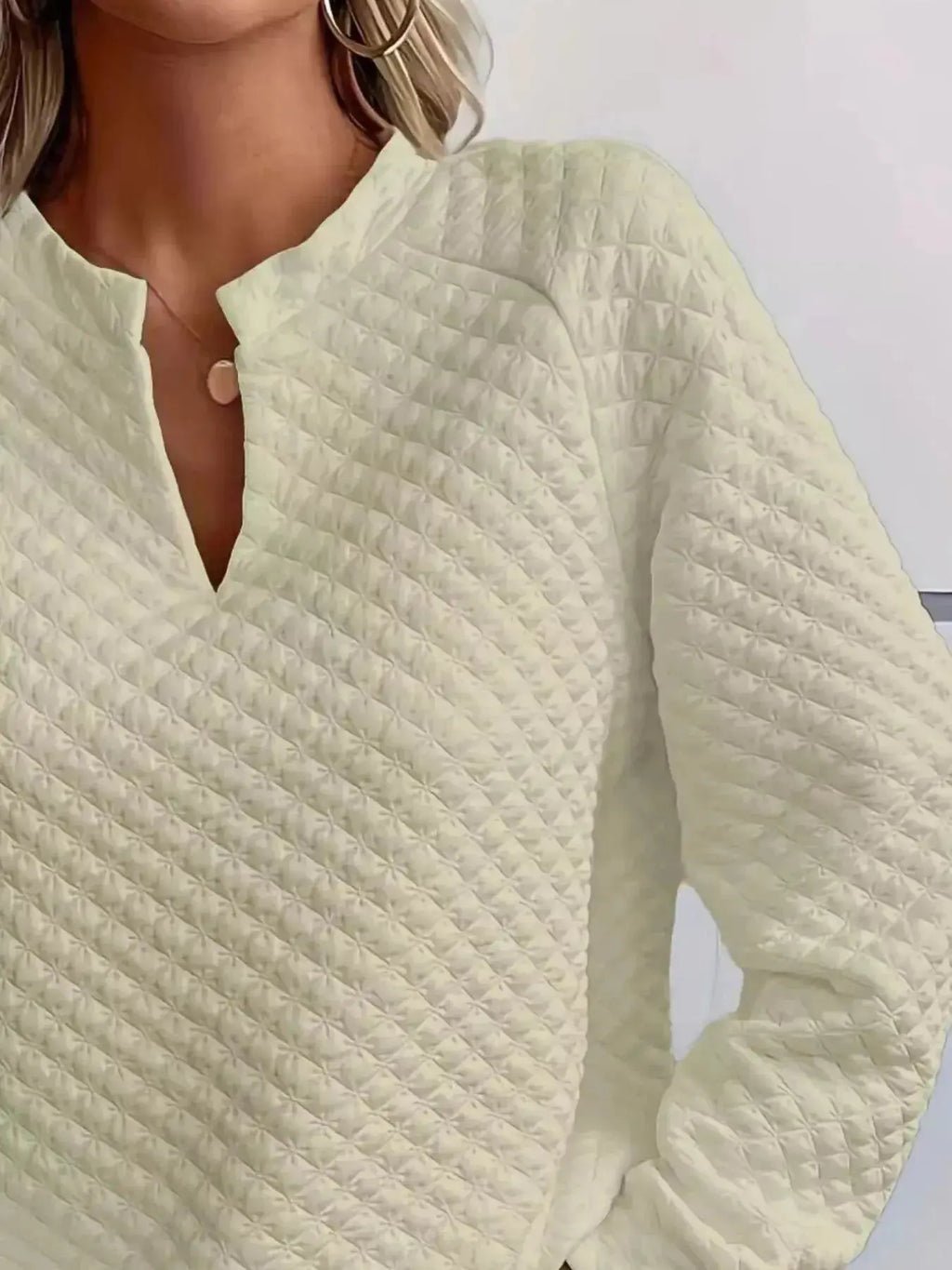 Women's plush fashion hub waffle-knit raglan sweatshirt with notched sleeves, soft textured pullover perfect for casual wear.