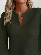 Women's plush fashion hub waffle-knit sweatshirt with notched raglan sleeves, soft textured pullover for casual wear.