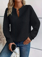 Women's notched raglan waffle-knit sweatshirt by Plush Fashion Hub featuring soft textured fabric and casual pullover style.