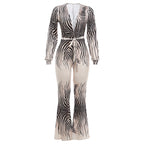 Pair of high-heeled shoes from Plush Fashion Hub featuring sleek design and pointed toes, complementing a stylish jumpsuit ensemble.