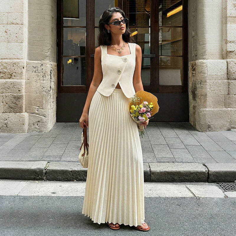 Elegant women's summer pleated skirt two-piece set featuring a flowy skirt and matching top from Plush Fashion Hub.