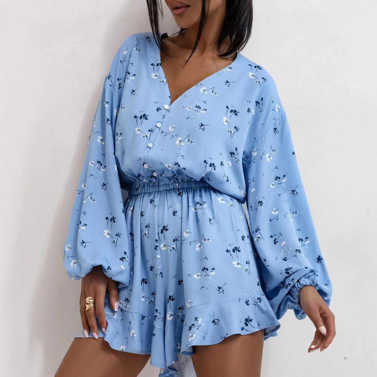 Women’s summer V-neck printed long sleeve jumpsuit with waist trimming and ruffle shorts, from Plush Fashion Hub.