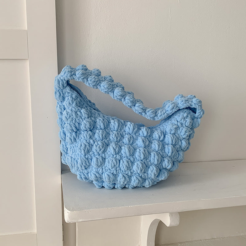 Cute handmade crocheted straw bag by Bella Mia, portable solid color beach tote with hand carry straps, perfect for seaside vacations.
