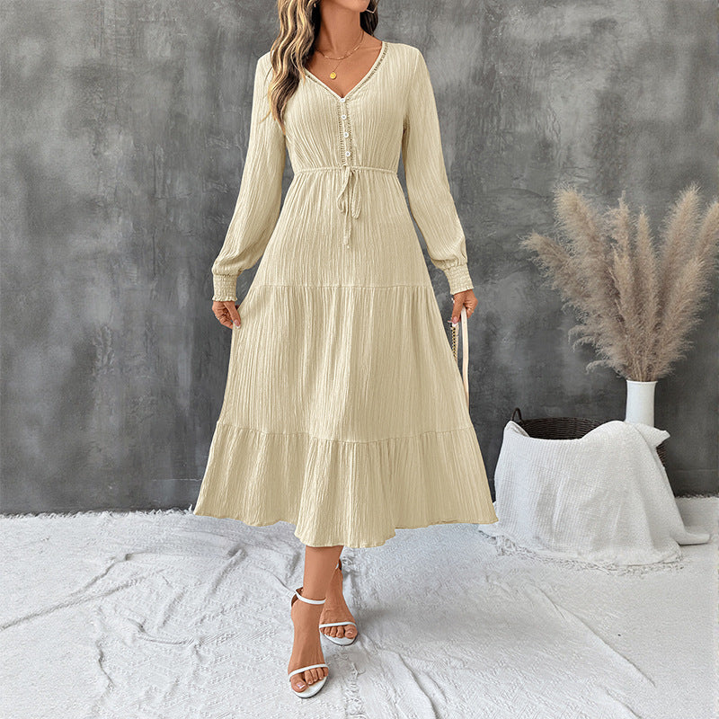 Elegant Bella Mia long sleeve pleated V-neck dress in solid color, perfect for autumn, shown on a model.