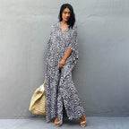 Printed long beach cover-up dress by Plush Fashion Hub featuring a maxi style, sun protection blouse, perfect for vacations and swimsuits.