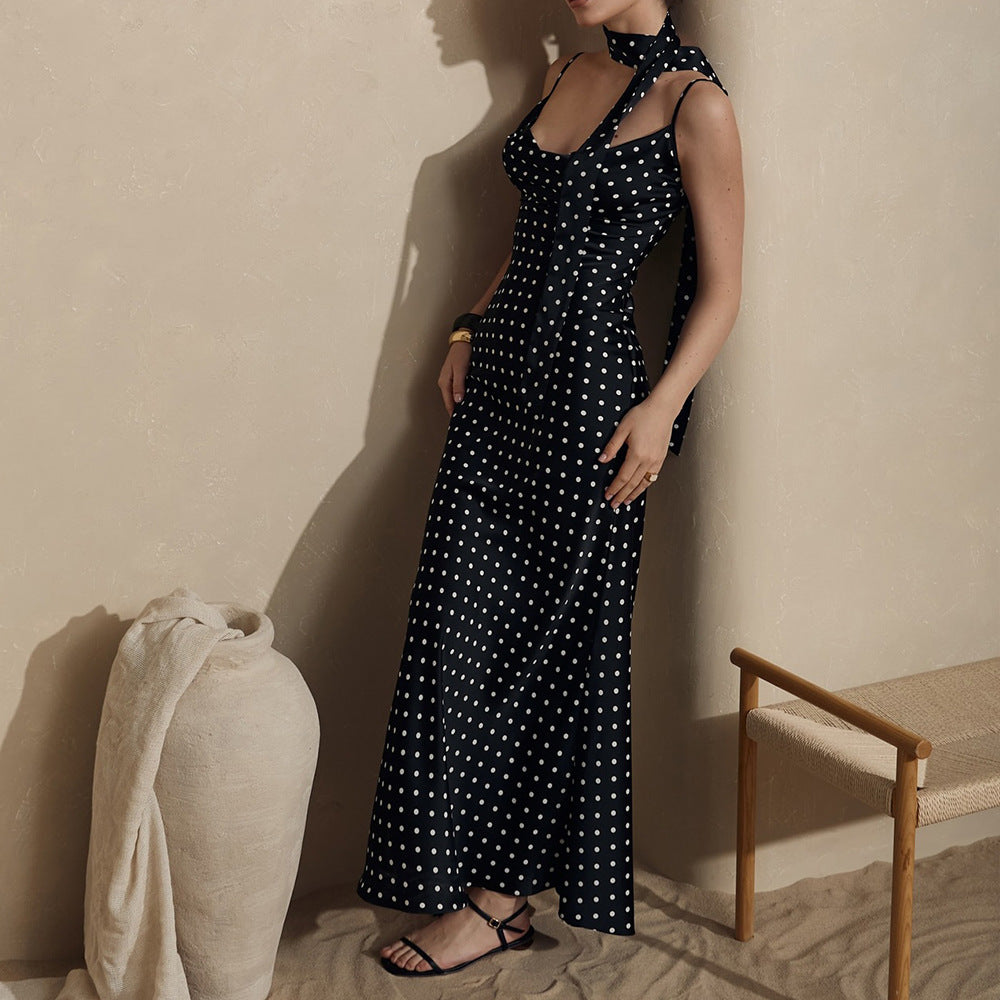 Polka dot strap maxi dress with halter neck and fishtail silhouette from Plush Fashion Hub, perfect for summer wear.