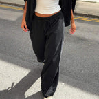 Women’s casual loose-fit trousers with drawstring waist in solid color, styled for autumn, by Bella Mia.