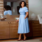 Women’s high waist dress with puff sleeves and round neck, stylish Plush Fashion Shop dress, shown on a model.