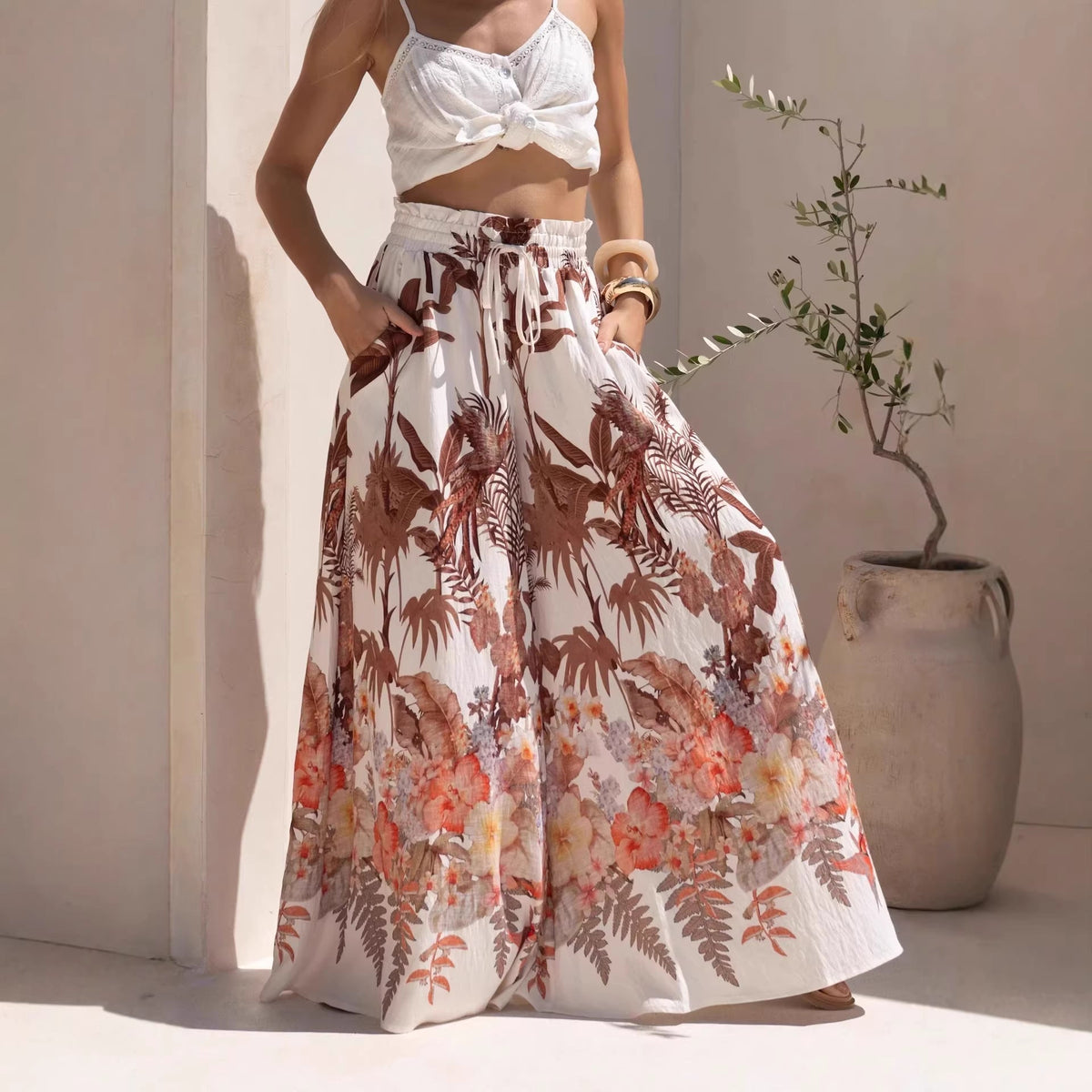Casual summer wide-leg pants with a green leaf print from Plush Fashion Hub, featuring a loose fit and comfortable design.