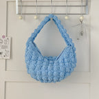 Cute handmade Bella Mia straw tote bag with solid color crochet design, perfect for seaside, beach, or vacation use.