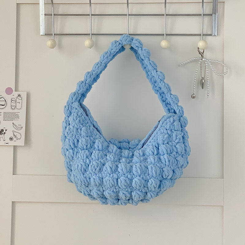 Cute handmade Bella Mia straw tote bag with solid color crochet design, perfect for seaside, beach, or vacation use.