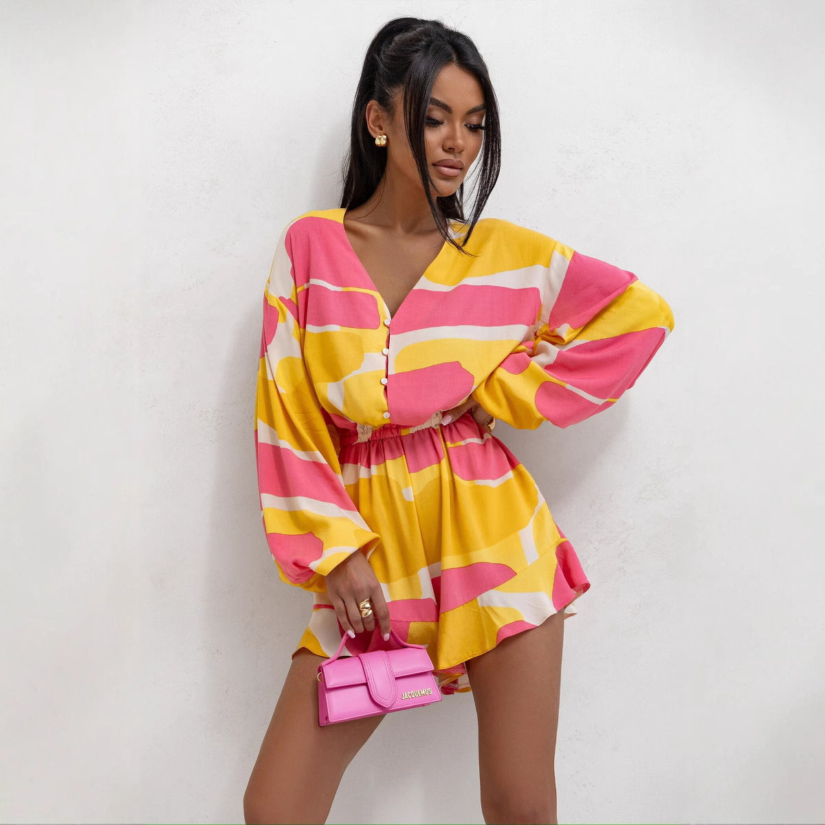 Women’s summer V-neck printed jumpsuit with long sleeves, waist trimming, ruffles, and shorts from Plush Fashion Hub.