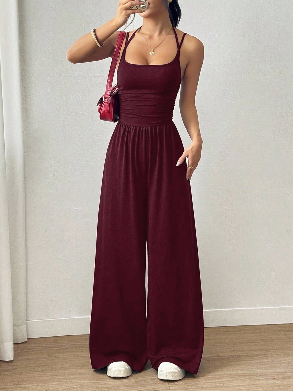 Casual women’s summer jumpsuit with wide-leg style, wrapped chest, nipped waist, and suspenders by Plush Fashion Hub.