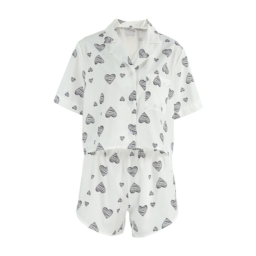 Pink heart-print short sleeve cardigan and split shorts pajamas set for women, comfortable casual home wear by Bella Mia.