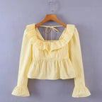 Bella Mia Summer Wind women’s long sleeve ruffled shirt in solid color, stylish top with feminine ruffle details.