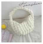 Handmade crochet straw beach bag by Bella Mia featuring a solid color, hand carry style perfect for seaside vacations.