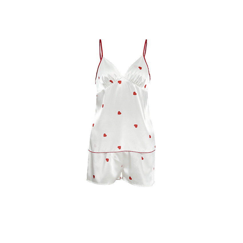 Bella Mia satin women's pajama set with heart-print suspender shorts, featuring a sexy two-piece design and elegant satin fabric.