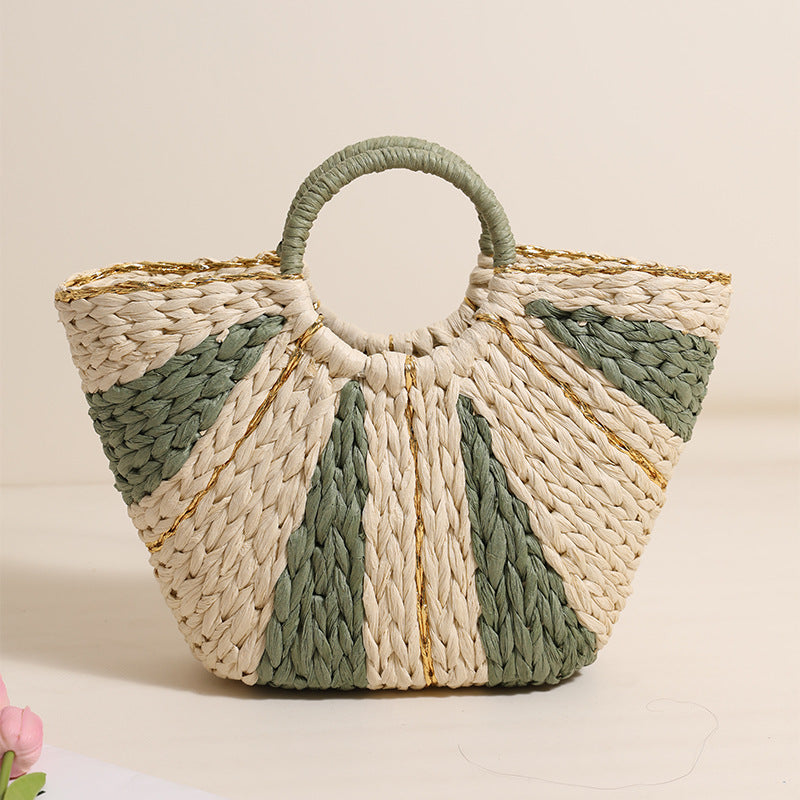 Large straw-weaved Bella Mia portable bag with contrast handles, perfect for beach, vacation, or vegetable shopping.